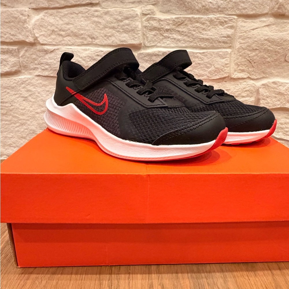 Nike Kids Black Sneakers with Red Swoosh